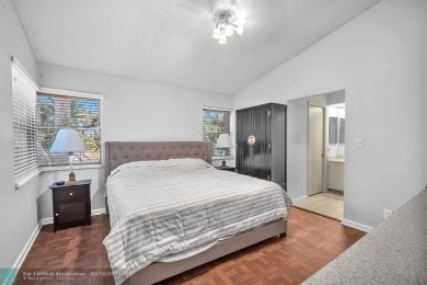 WELCOME TO 5628 PLEASANT VALLEY LANE -- A SERENE RETREAT NESTLED on Boca Delray Golf and Country Club in Florida - for sale on GolfHomes.com, golf home, golf lot