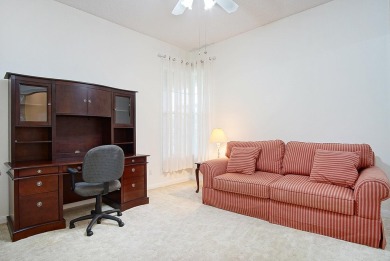 Relax looking out of this wide lake view in this freshly painted on St. Lucie Trail Golf Club in Florida - for sale on GolfHomes.com, golf home, golf lot
