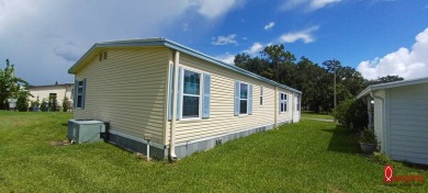 Come settle down and relax in a beautiful manufactured home with on Fairways Country Club in Florida - for sale on GolfHomes.com, golf home, golf lot