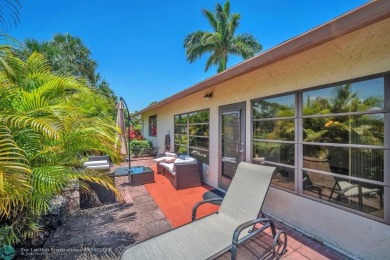 WELCOME TO 5628 PLEASANT VALLEY LANE -- A SERENE RETREAT NESTLED on Boca Delray Golf and Country Club in Florida - for sale on GolfHomes.com, golf home, golf lot