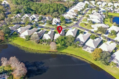 Relax looking out of this wide lake view in this freshly painted on St. Lucie Trail Golf Club in Florida - for sale on GolfHomes.com, golf home, golf lot