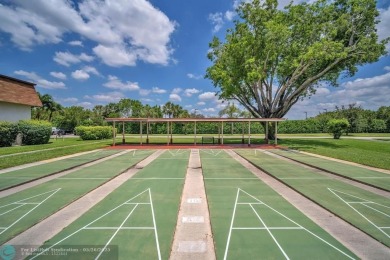 WELCOME TO 5628 PLEASANT VALLEY LANE -- A SERENE RETREAT NESTLED on Boca Delray Golf and Country Club in Florida - for sale on GolfHomes.com, golf home, golf lot