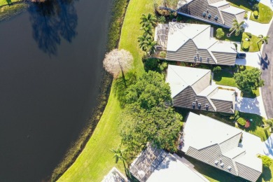 Relax looking out of this wide lake view in this freshly painted on St. Lucie Trail Golf Club in Florida - for sale on GolfHomes.com, golf home, golf lot
