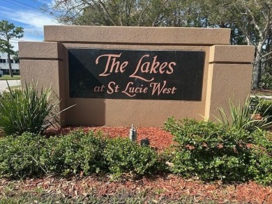 Relax looking out of this wide lake view in this freshly painted on St. Lucie Trail Golf Club in Florida - for sale on GolfHomes.com, golf home, golf lot