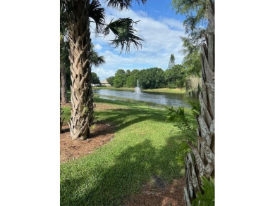 Relax looking out of this wide lake view in this freshly painted on St. Lucie Trail Golf Club in Florida - for sale on GolfHomes.com, golf home, golf lot