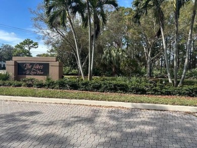 Relax looking out of this wide lake view in this freshly painted on St. Lucie Trail Golf Club in Florida - for sale on GolfHomes.com, golf home, golf lot