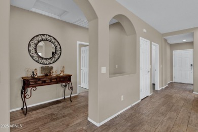 This wonderful single-story residence offers 3 spacious bedrooms on The Golf Club At Johnson Ranch in Arizona - for sale on GolfHomes.com, golf home, golf lot