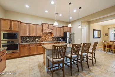 Stunning residence located in Quailwood, featuring a golf course on Quail Wood Greens Golf Course in Arizona - for sale on GolfHomes.com, golf home, golf lot