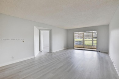 Freshly painted and newly floored ground-floor 2-bedroom on Flamingo Lakes Country Club in Florida - for sale on GolfHomes.com, golf home, golf lot