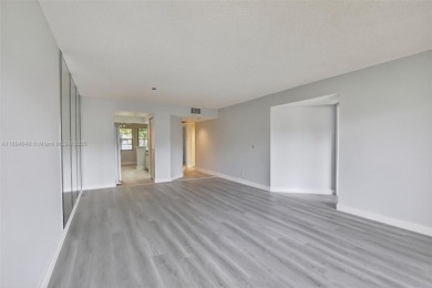 Freshly painted and newly floored ground-floor 2-bedroom on Flamingo Lakes Country Club in Florida - for sale on GolfHomes.com, golf home, golf lot
