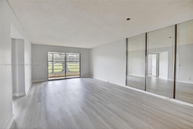 Freshly painted and newly floored ground-floor 2-bedroom on Flamingo Lakes Country Club in Florida - for sale on GolfHomes.com, golf home, golf lot