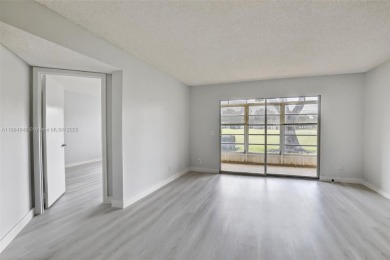 Freshly painted and newly floored ground-floor 2-bedroom on Flamingo Lakes Country Club in Florida - for sale on GolfHomes.com, golf home, golf lot