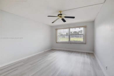 Freshly painted and newly floored ground-floor 2-bedroom on Flamingo Lakes Country Club in Florida - for sale on GolfHomes.com, golf home, golf lot