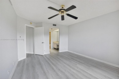 Freshly painted and newly floored ground-floor 2-bedroom on Flamingo Lakes Country Club in Florida - for sale on GolfHomes.com, golf home, golf lot