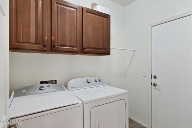 This wonderful single-story residence offers 3 spacious bedrooms on The Golf Club At Johnson Ranch in Arizona - for sale on GolfHomes.com, golf home, golf lot
