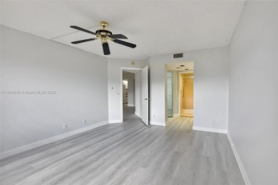 Freshly painted and newly floored ground-floor 2-bedroom on Flamingo Lakes Country Club in Florida - for sale on GolfHomes.com, golf home, golf lot