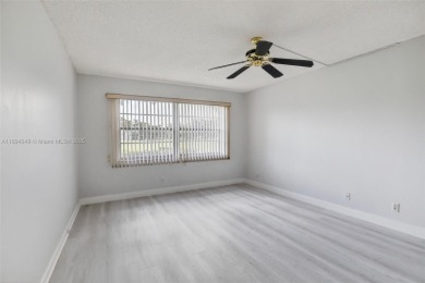 Freshly painted and newly floored ground-floor 2-bedroom on Flamingo Lakes Country Club in Florida - for sale on GolfHomes.com, golf home, golf lot