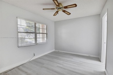 Freshly painted and newly floored ground-floor 2-bedroom on Flamingo Lakes Country Club in Florida - for sale on GolfHomes.com, golf home, golf lot