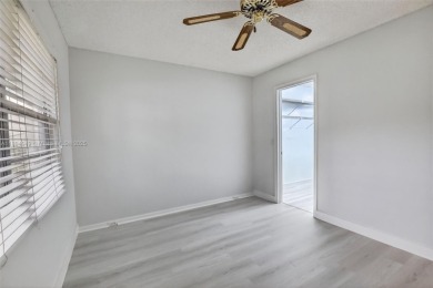 Freshly painted and newly floored ground-floor 2-bedroom on Flamingo Lakes Country Club in Florida - for sale on GolfHomes.com, golf home, golf lot