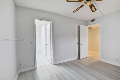 Freshly painted and newly floored ground-floor 2-bedroom on Flamingo Lakes Country Club in Florida - for sale on GolfHomes.com, golf home, golf lot