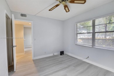 Freshly painted and newly floored ground-floor 2-bedroom on Flamingo Lakes Country Club in Florida - for sale on GolfHomes.com, golf home, golf lot