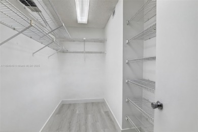 Freshly painted and newly floored ground-floor 2-bedroom on Flamingo Lakes Country Club in Florida - for sale on GolfHomes.com, golf home, golf lot