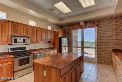 Stunning residence located in Quailwood, featuring a premium on Quail Wood Greens Golf Course in Arizona - for sale on GolfHomes.com, golf home, golf lot