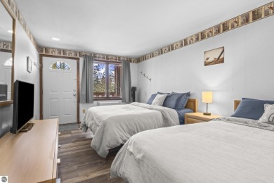 This is a sharp two-bedroom condominium located within 500 feet on Schuss Mountain Golf Club in Michigan - for sale on GolfHomes.com, golf home, golf lot