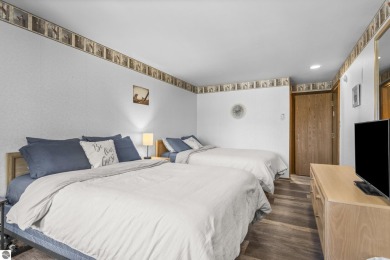 This is a sharp two-bedroom condominium located within 500 feet on Schuss Mountain Golf Club in Michigan - for sale on GolfHomes.com, golf home, golf lot