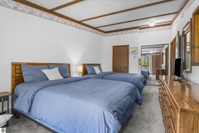 This is a sharp two-bedroom condominium located within 500 feet on Schuss Mountain Golf Club in Michigan - for sale on GolfHomes.com, golf home, golf lot