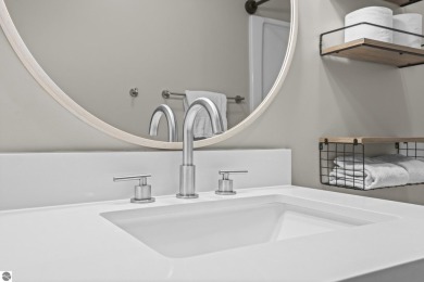This is a sharp two-bedroom condominium located within 500 feet on Schuss Mountain Golf Club in Michigan - for sale on GolfHomes.com, golf home, golf lot