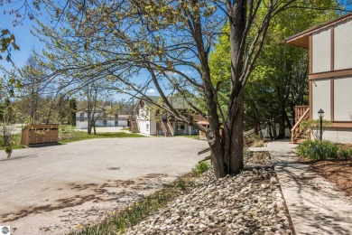 This is a sharp two-bedroom condominium located within 500 feet on Schuss Mountain Golf Club in Michigan - for sale on GolfHomes.com, golf home, golf lot