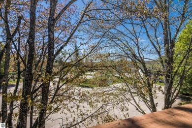 This is a sharp two-bedroom condominium located within 500 feet on Schuss Mountain Golf Club in Michigan - for sale on GolfHomes.com, golf home, golf lot
