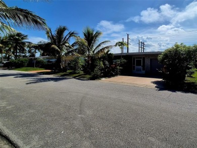 THIS HOME IS THE LARGEST MODEL BUILT IN THE COMMUNITY. IT CAN BE on Oriole Golf and Tennis Club in Florida - for sale on GolfHomes.com, golf home, golf lot