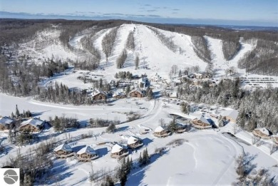 This is a sharp two-bedroom condominium located within 500 feet on Schuss Mountain Golf Club in Michigan - for sale on GolfHomes.com, golf home, golf lot