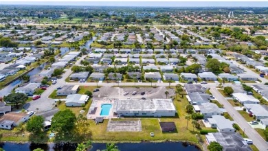 THIS HOME IS THE LARGEST MODEL BUILT IN THE COMMUNITY. IT CAN BE on Oriole Golf and Tennis Club in Florida - for sale on GolfHomes.com, golf home, golf lot