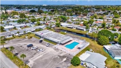 THIS HOME IS THE LARGEST MODEL BUILT IN THE COMMUNITY. IT CAN BE on Oriole Golf and Tennis Club in Florida - for sale on GolfHomes.com, golf home, golf lot