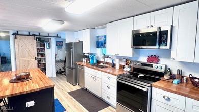 Beautiful WATERFRONT 2BR/2BA home in the desirable 55+ community on Riverbend Golf and Country Club in Florida - for sale on GolfHomes.com, golf home, golf lot