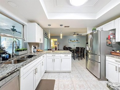 SERENITY AWAITS WITH THIS MOVE-IN READY home with private oasis on Seven Springs Golf and Country Club in Florida - for sale on GolfHomes.com, golf home, golf lot