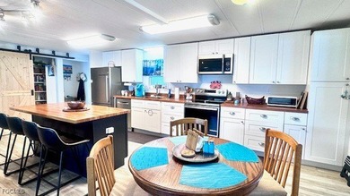 Beautiful WATERFRONT 2BR/2BA home in the desirable 55+ community on Riverbend Golf and Country Club in Florida - for sale on GolfHomes.com, golf home, golf lot