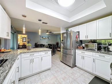 SERENITY AWAITS WITH THIS MOVE-IN READY home with private oasis on Seven Springs Golf and Country Club in Florida - for sale on GolfHomes.com, golf home, golf lot