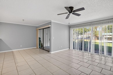 Beautiful first-floor corner unit in the resort-style community on Ocean Village Golf Course in Florida - for sale on GolfHomes.com, golf home, golf lot