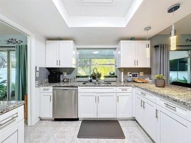 SERENITY AWAITS WITH THIS MOVE-IN READY home with private oasis on Seven Springs Golf and Country Club in Florida - for sale on GolfHomes.com, golf home, golf lot