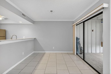 Beautiful first-floor corner unit in the resort-style community on Ocean Village Golf Course in Florida - for sale on GolfHomes.com, golf home, golf lot