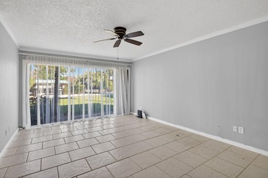 Beautiful first-floor corner unit in the resort-style community on Ocean Village Golf Course in Florida - for sale on GolfHomes.com, golf home, golf lot