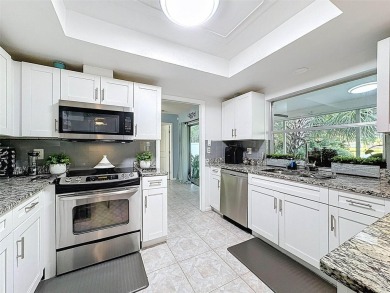 SERENITY AWAITS WITH THIS MOVE-IN READY home with private oasis on Seven Springs Golf and Country Club in Florida - for sale on GolfHomes.com, golf home, golf lot
