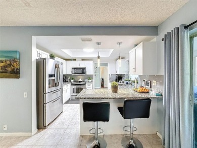 SERENITY AWAITS WITH THIS MOVE-IN READY home with private oasis on Seven Springs Golf and Country Club in Florida - for sale on GolfHomes.com, golf home, golf lot