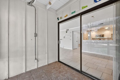 Beautiful first-floor corner unit in the resort-style community on Ocean Village Golf Course in Florida - for sale on GolfHomes.com, golf home, golf lot