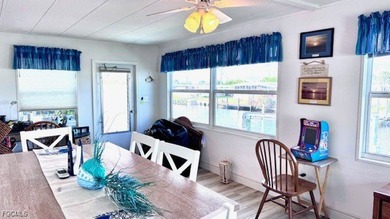 Beautiful WATERFRONT 2BR/2BA home in the desirable 55+ community on Riverbend Golf and Country Club in Florida - for sale on GolfHomes.com, golf home, golf lot