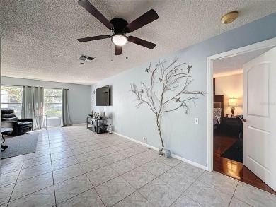 SERENITY AWAITS WITH THIS MOVE-IN READY home with private oasis on Seven Springs Golf and Country Club in Florida - for sale on GolfHomes.com, golf home, golf lot